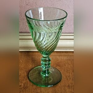 Duncan & Miller "Spiral Flutes" green pressed glass wine goblet.